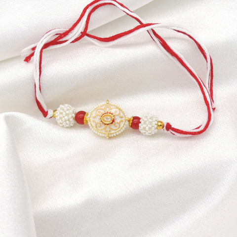 Pearl Designer Rakhi with Red Beads