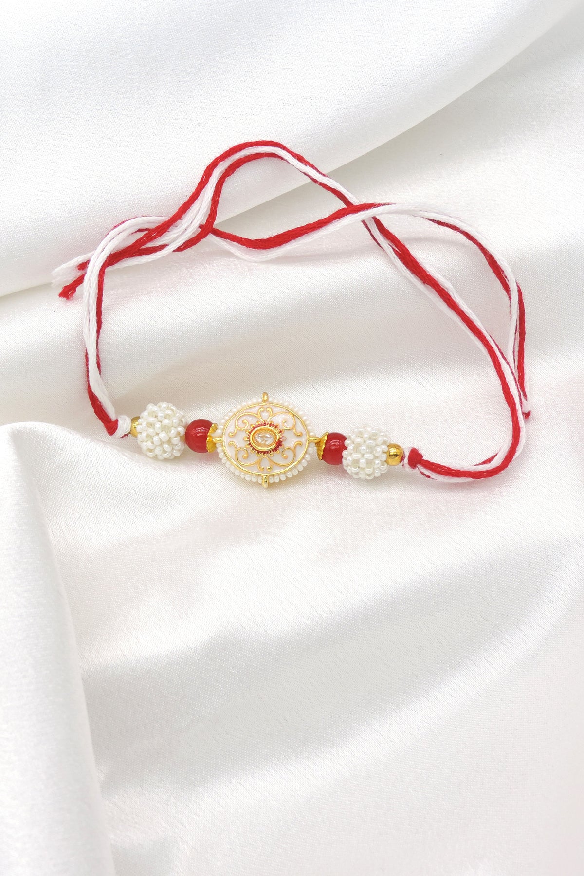 Pearl Designer Rakhi with Red Beads