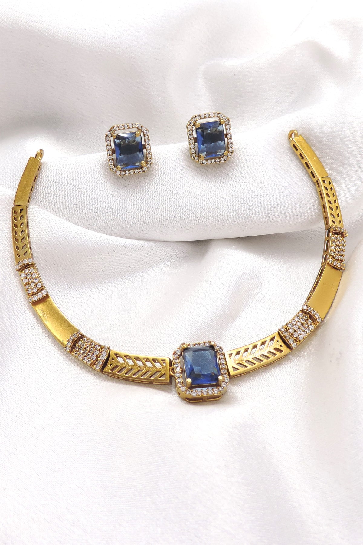 Blue CZ AD necklace with matching earrings and gold-tone detailing by joyrias