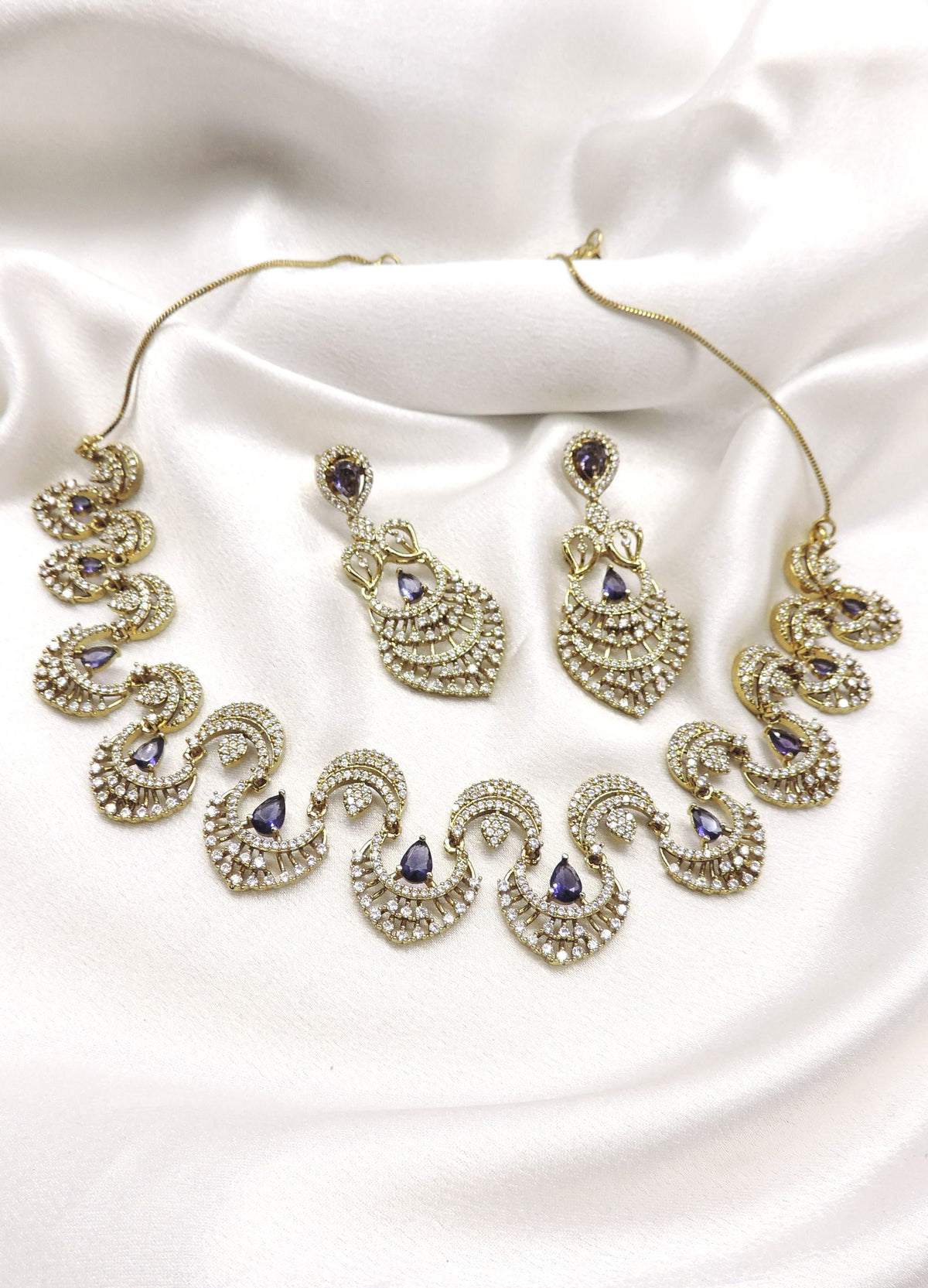Violet CZ AD necklace set with matching earrings and gold-tone detailing by joyrias