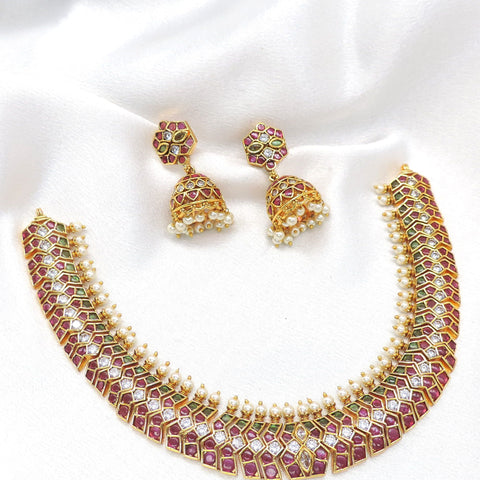 Kundan ruby necklace set with pearl jhumka earrings by joyrias