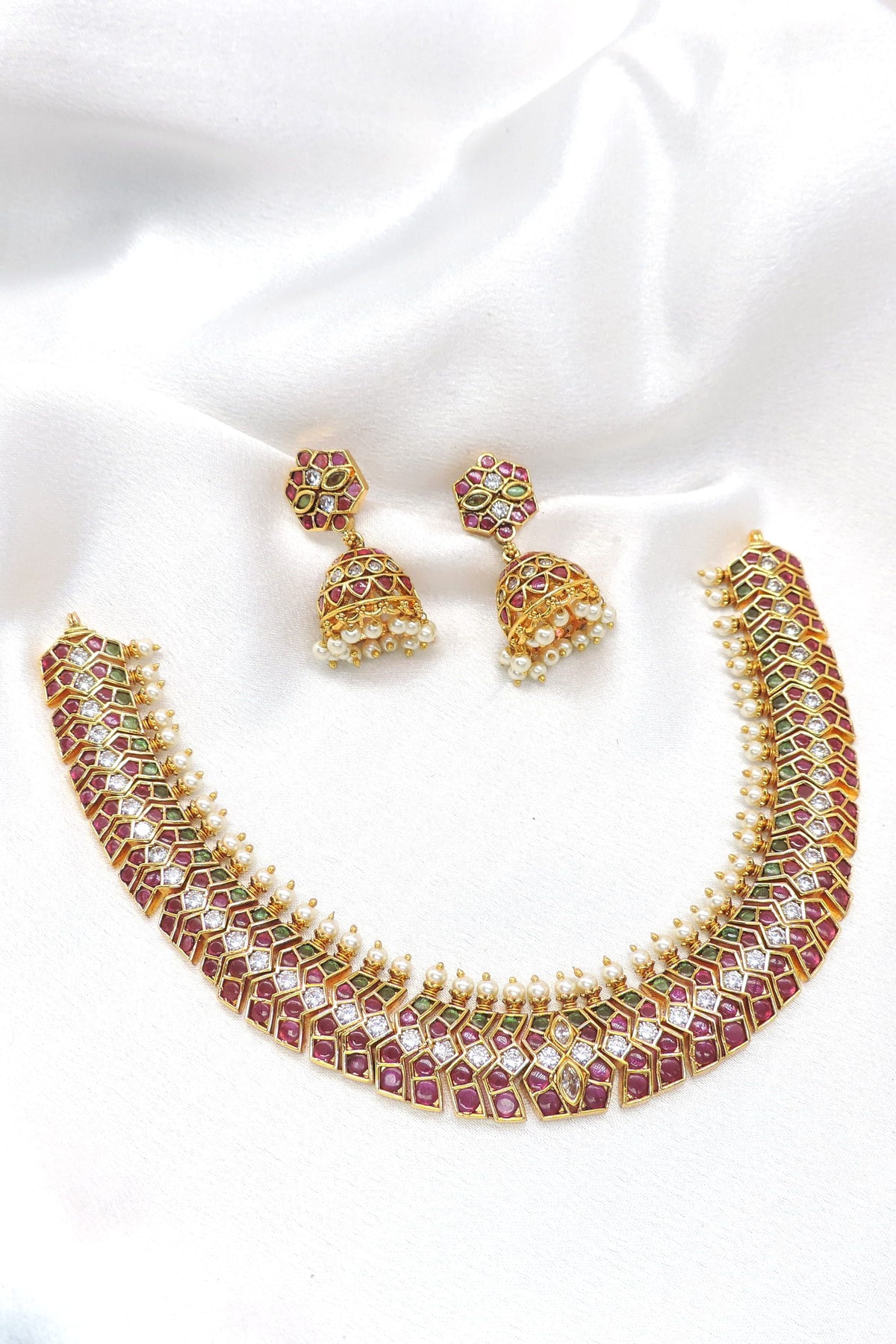 Kundan ruby necklace set with pearl jhumka earrings by joyrias