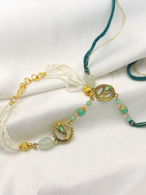 Peacock feather mint pearl bhaiya bhabhi rakhi set by Joyrias