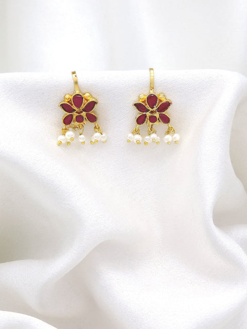 Gold-toned maroon floral pearl drop earrings with traditional detailing by joyrias