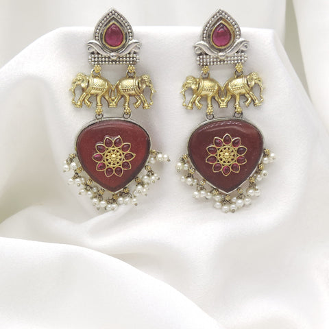 Oxidized dual-tone elephant maroon pearl drop earrings with gold-toned and silver detailing by joyrias