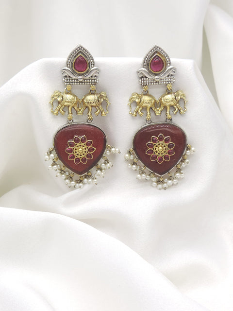 Oxidized dual-tone elephant maroon pearl drop earrings with gold-toned and silver detailing by joyrias