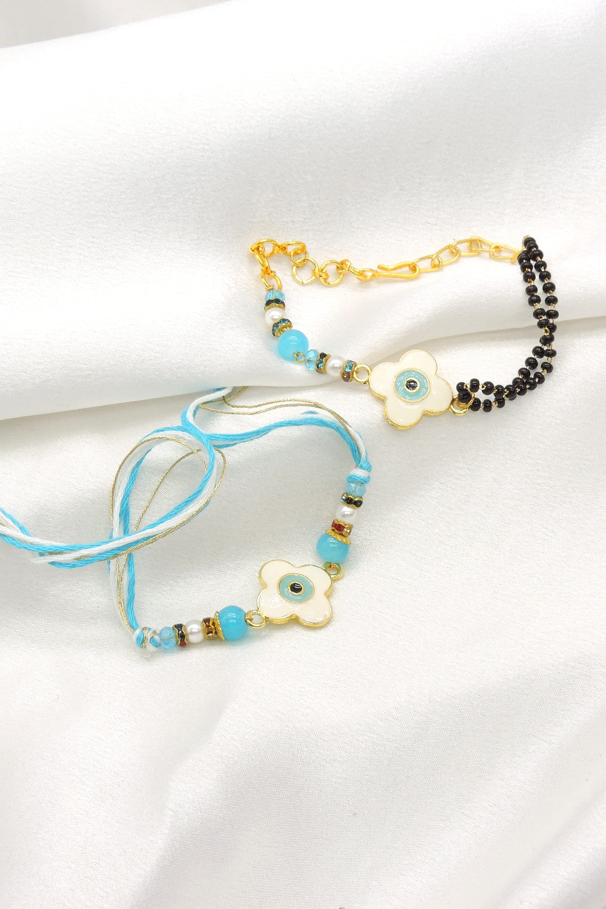Floral evil eye turquoise mangalsutra bhaiya bhabhi rakhi set by Joyrias