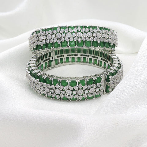 Magnificent silver-toned green stone AD bangle set with intricate sparkling detailing by joyrias