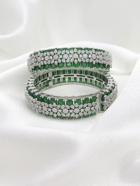 Magnificent silver-toned green stone AD bangle set with intricate sparkling detailing by joyrias