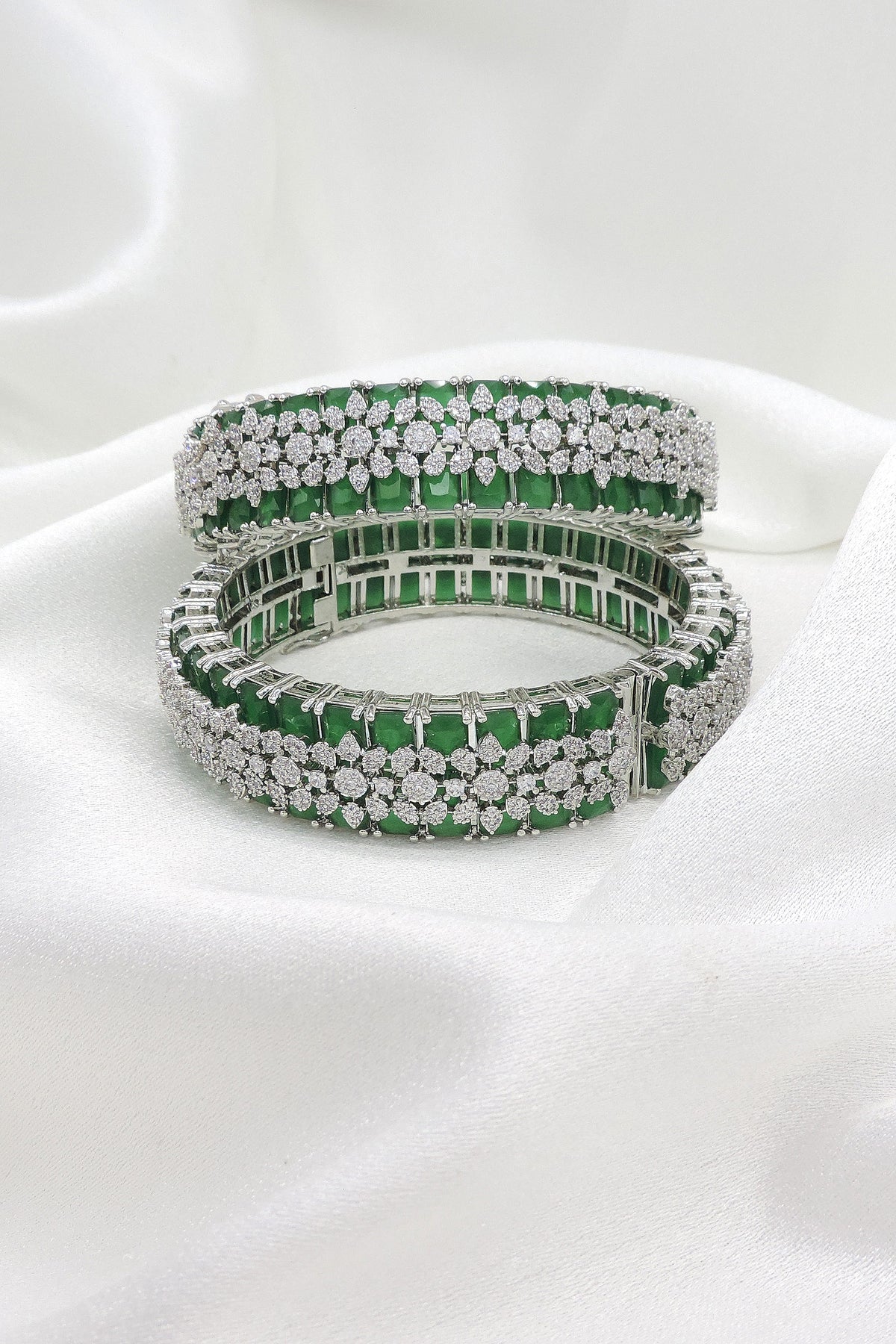 Magnificent silver-toned green stone AD bangle set with intricate sparkling detailing by joyrias
