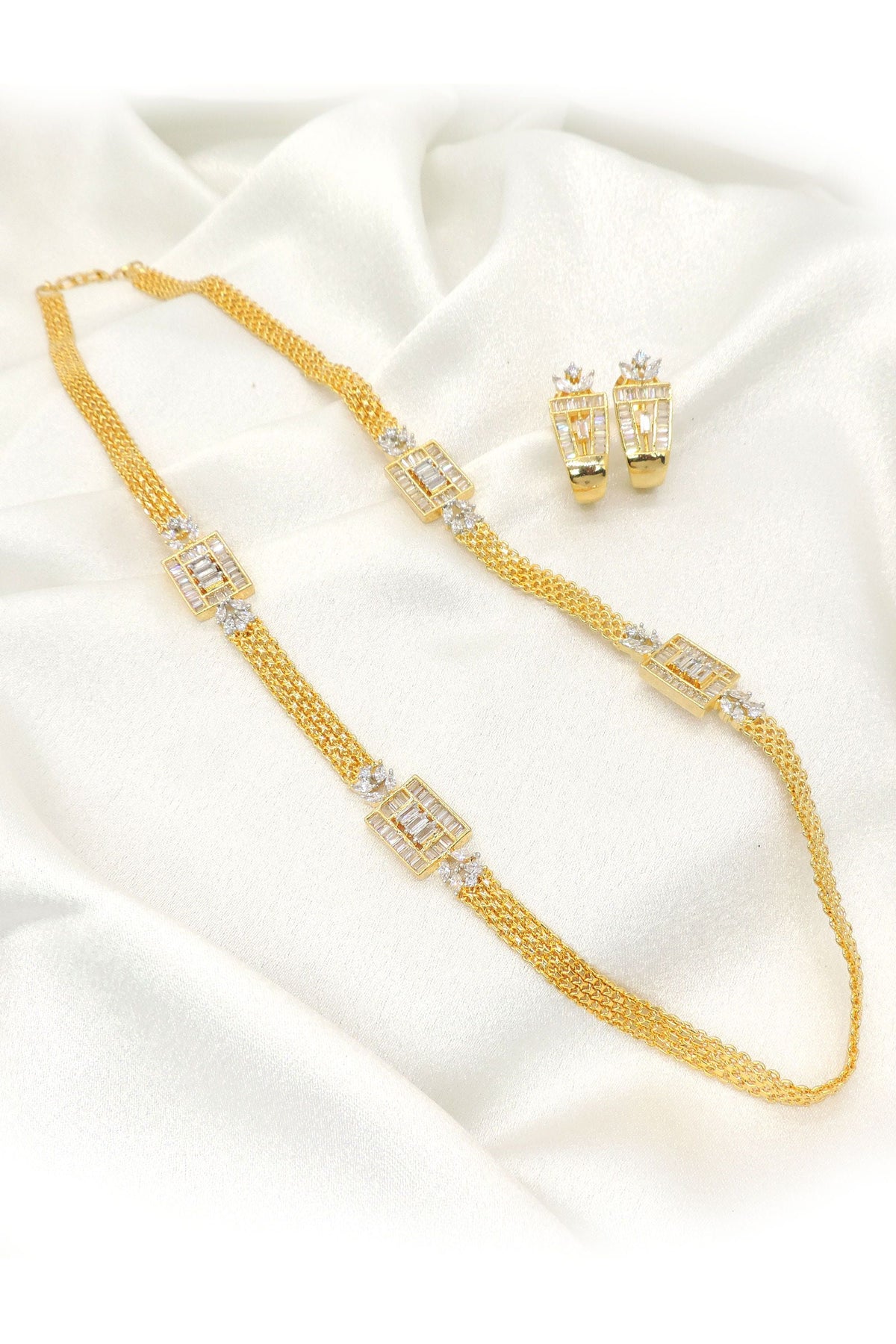 Luxe gold layered CZ necklace set with crystal accents and matching earrings