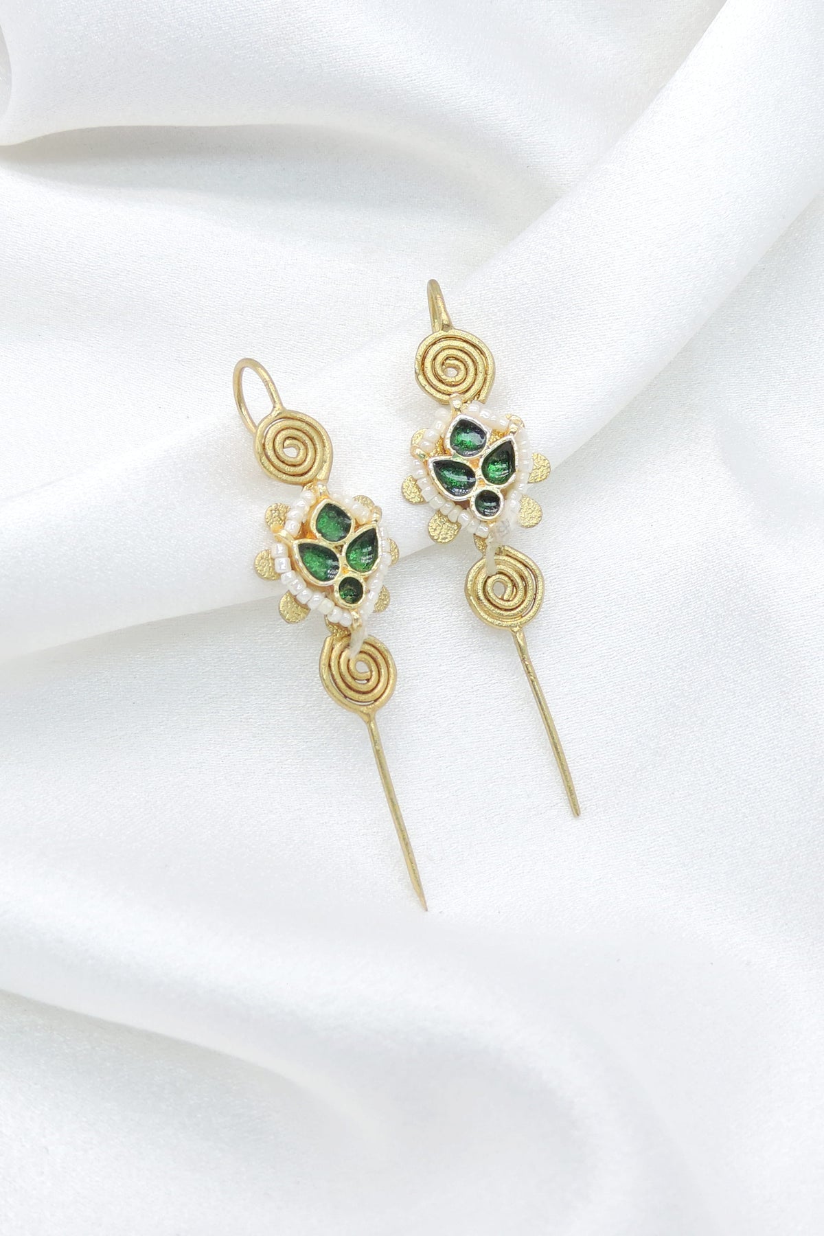 Gold-toned green spiral floral ear cuff earrings with white bead detailing by joyrias