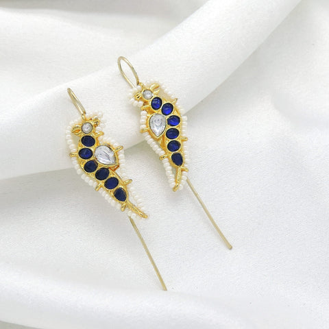 Gold-toned blue stone ear cuff earrings with white bead detailing by joyrias