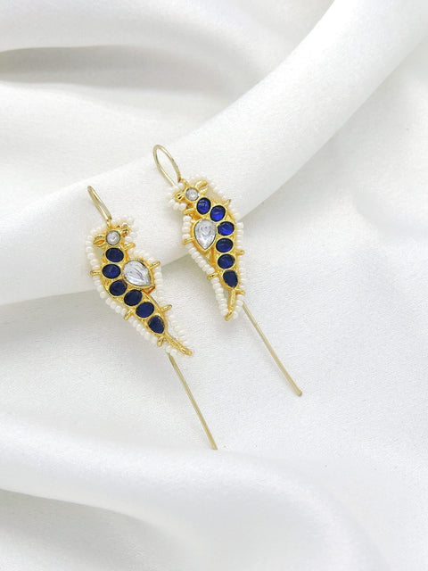 Gold-toned blue stone ear cuff earrings with white bead detailing by joyrias