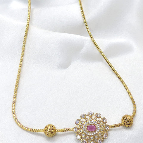Pink CZ AD necklace with circular pendant and gold-tone detailing by joyrias