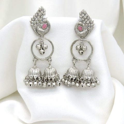 Oxidized silver peacock pink stone double jhumka earrings with intricate feather detailing by joyrias