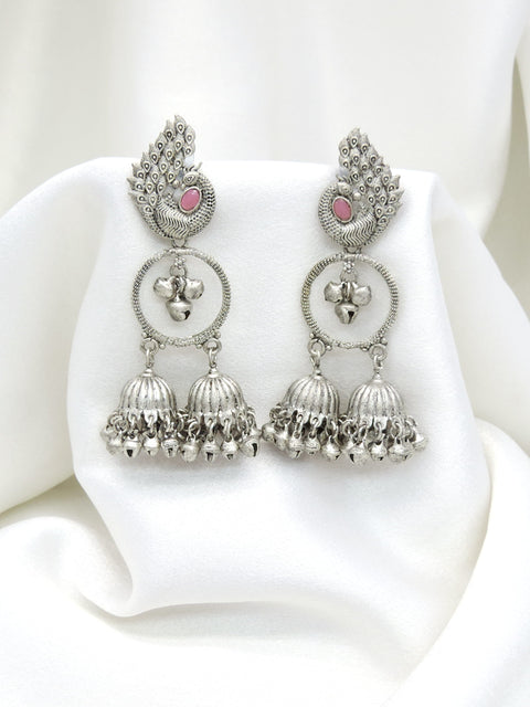 Oxidized silver peacock pink stone double jhumka earrings with intricate feather detailing by joyrias