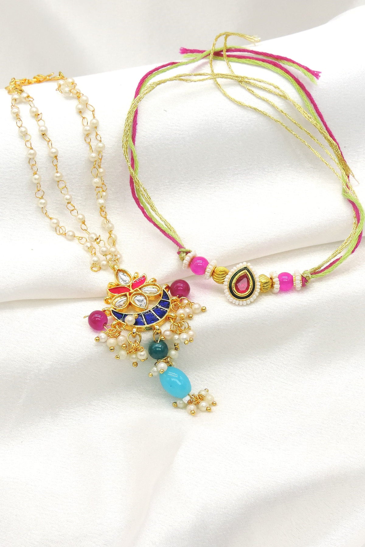 Multicolor kundan crescent pearl bhaiya bhabhi rakhi set by Joyrias