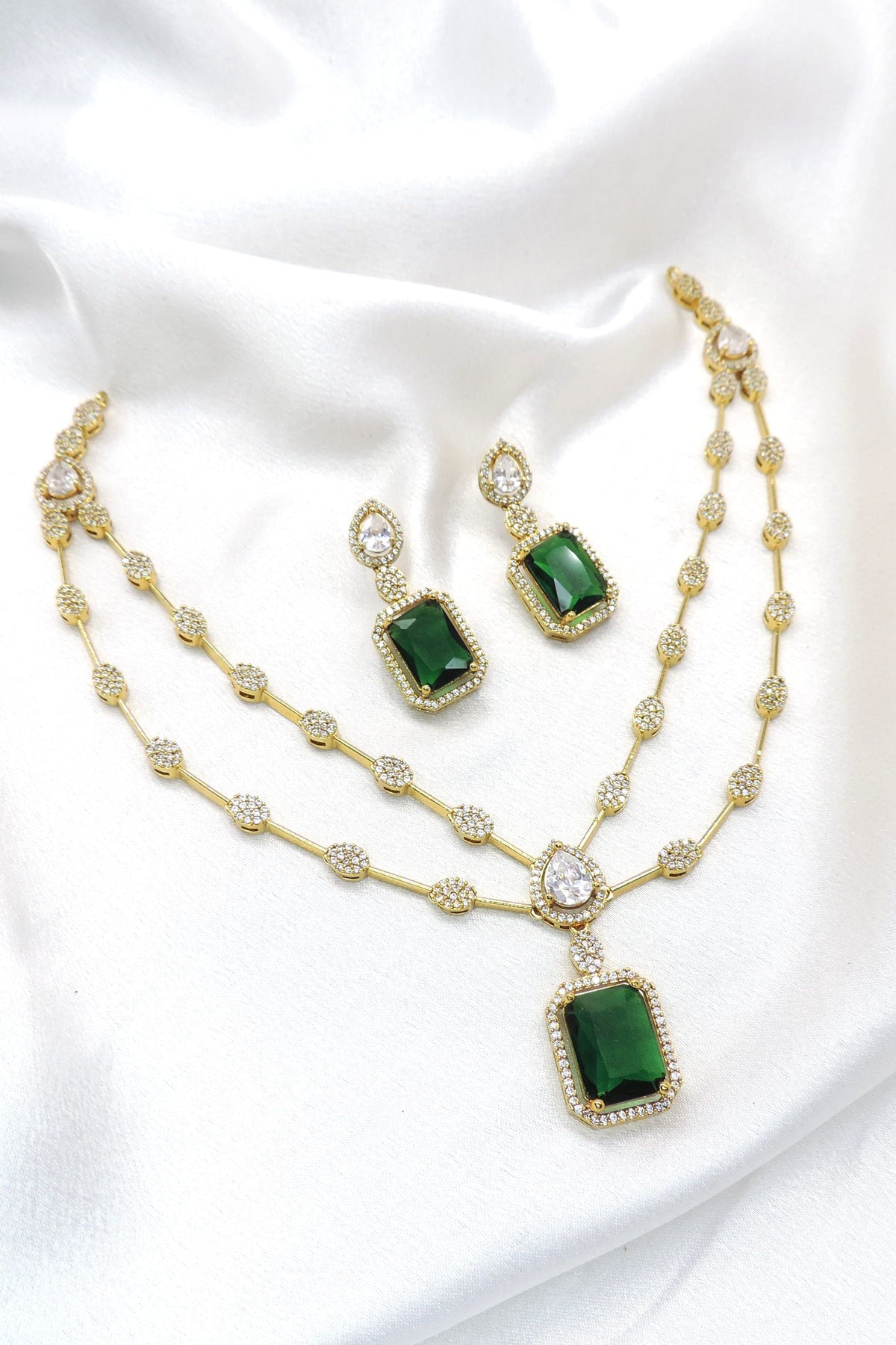 Emerald green CZ AD necklace with matching earrings and pendant by joyrias