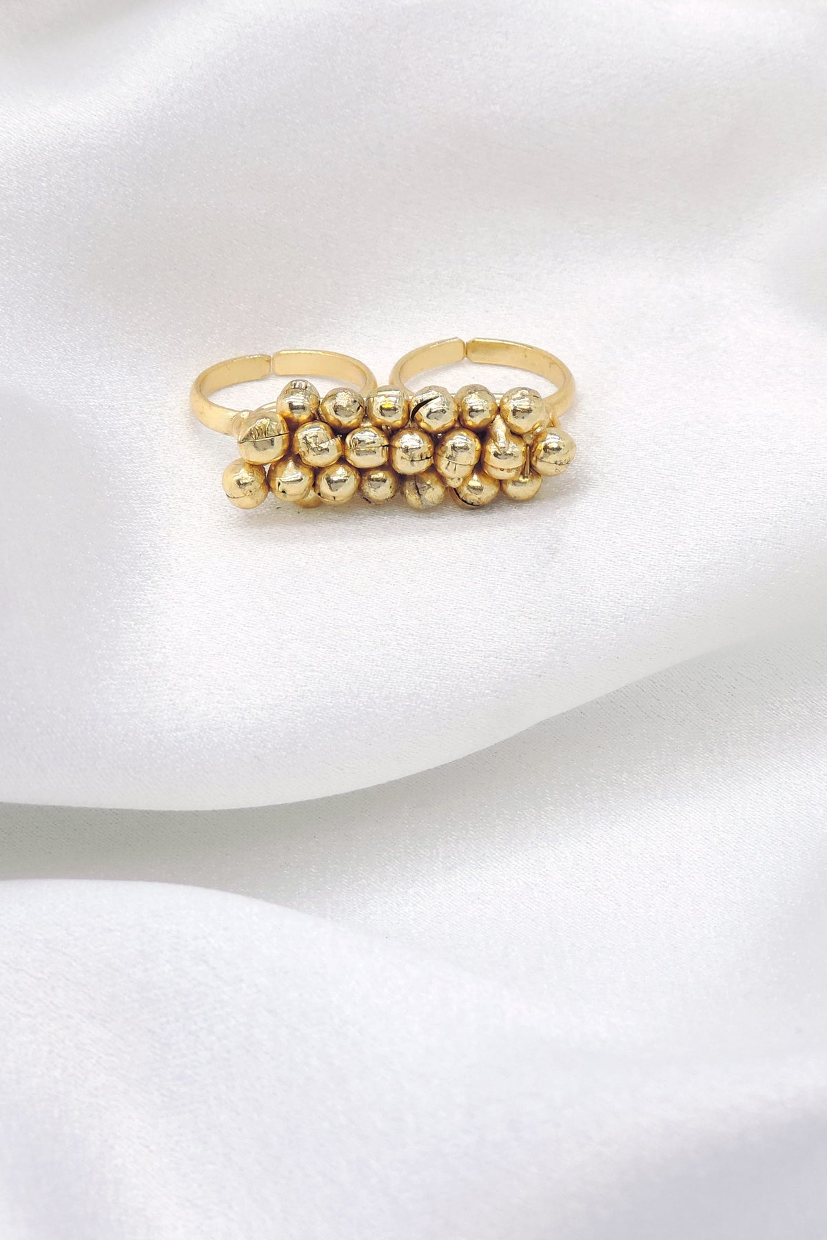 Gold-toned beaded double finger ring with traditional detailing by joyrias