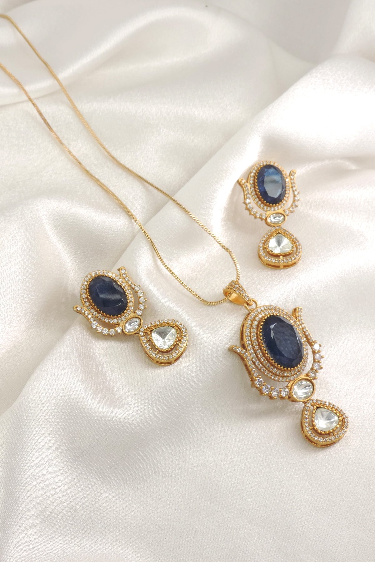 Blue Kundan Pendant Set by Joyrias