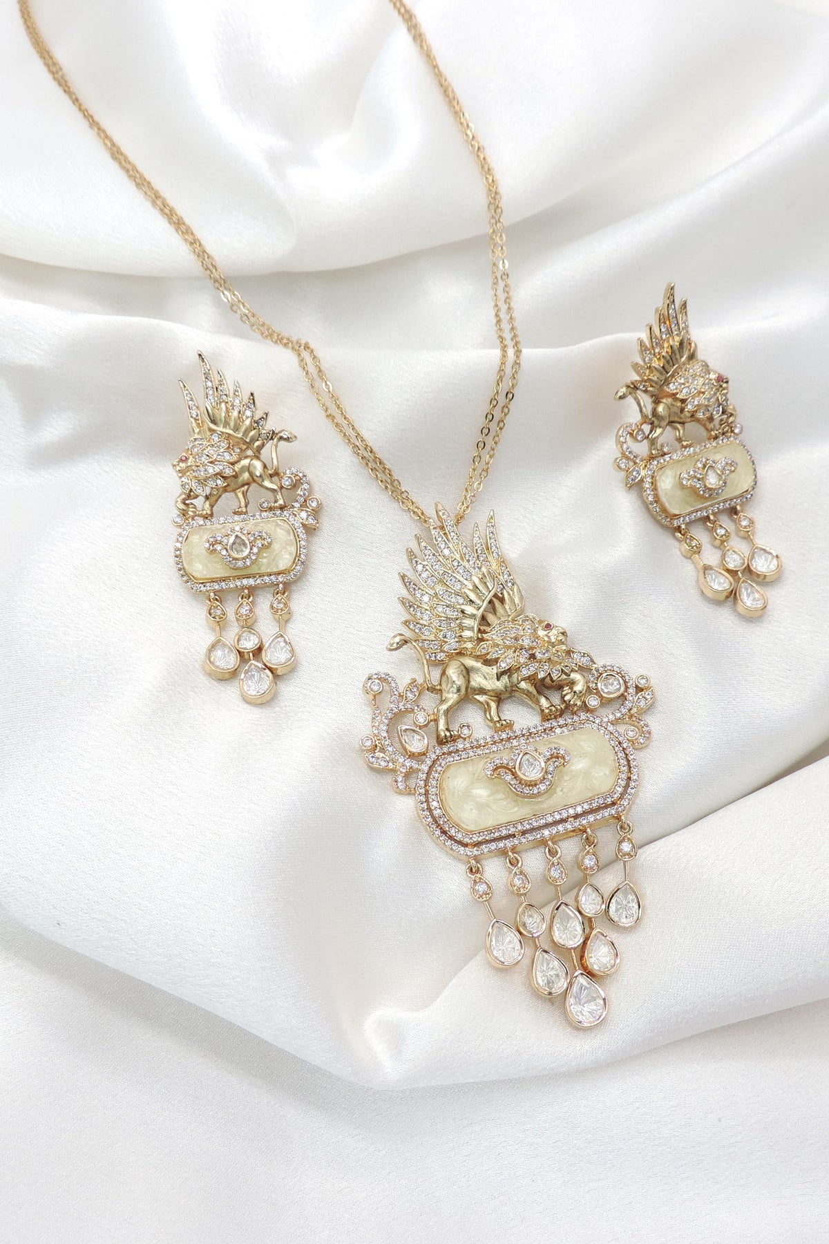 Winged lion pendant necklace set by Joyrias