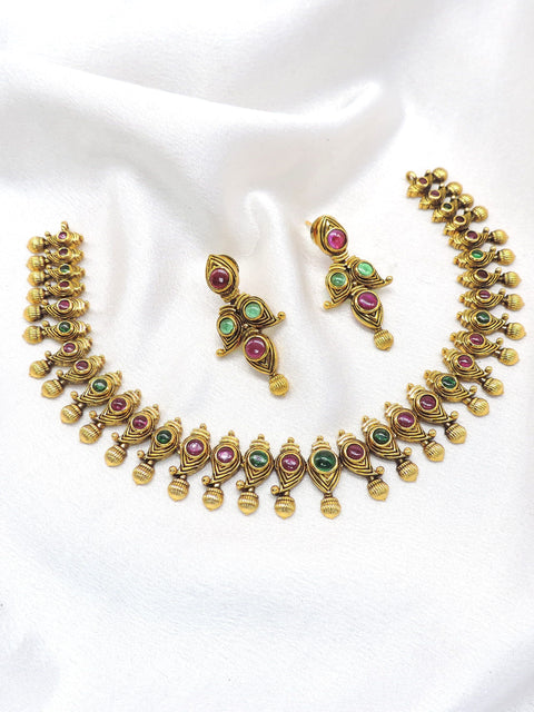 Temple gold-toned maroon green peacock necklace set with matching earrings by joyrias