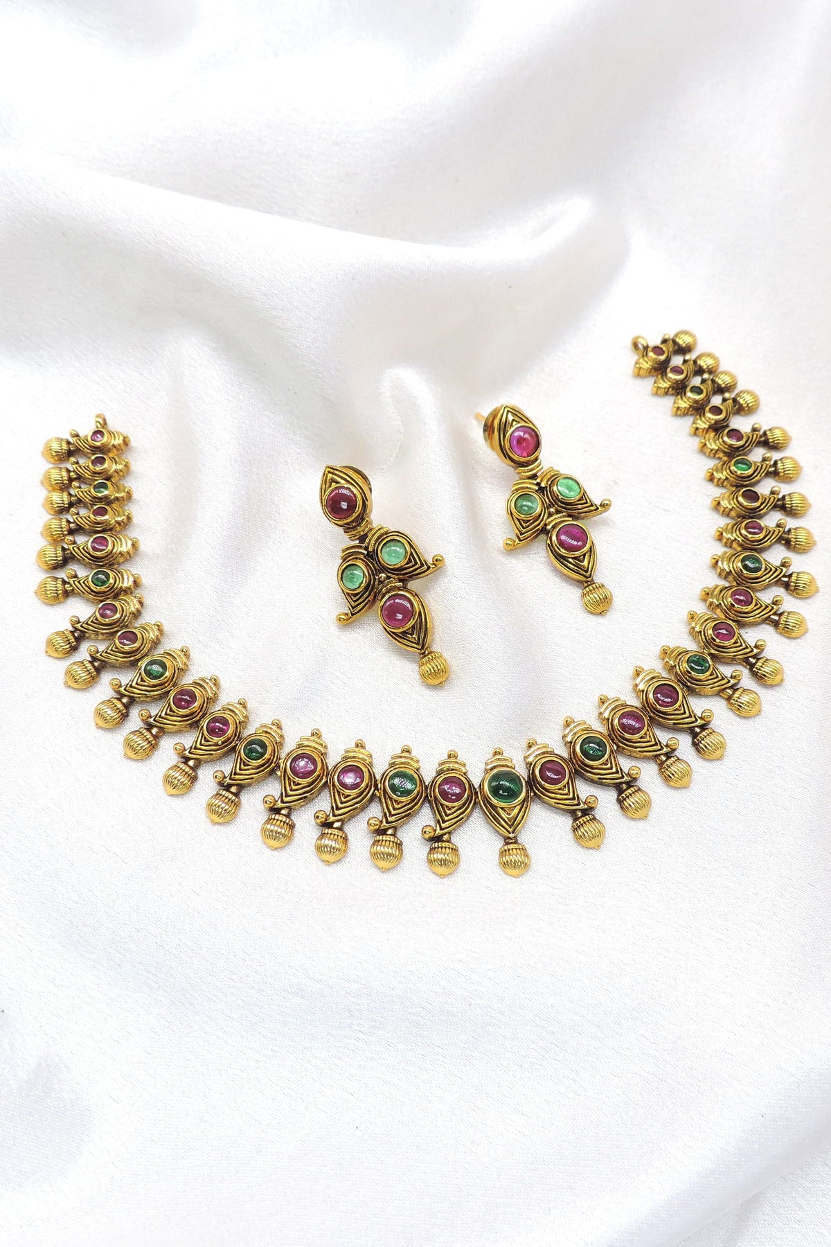 Temple gold-toned maroon green peacock necklace set with matching earrings by joyrias