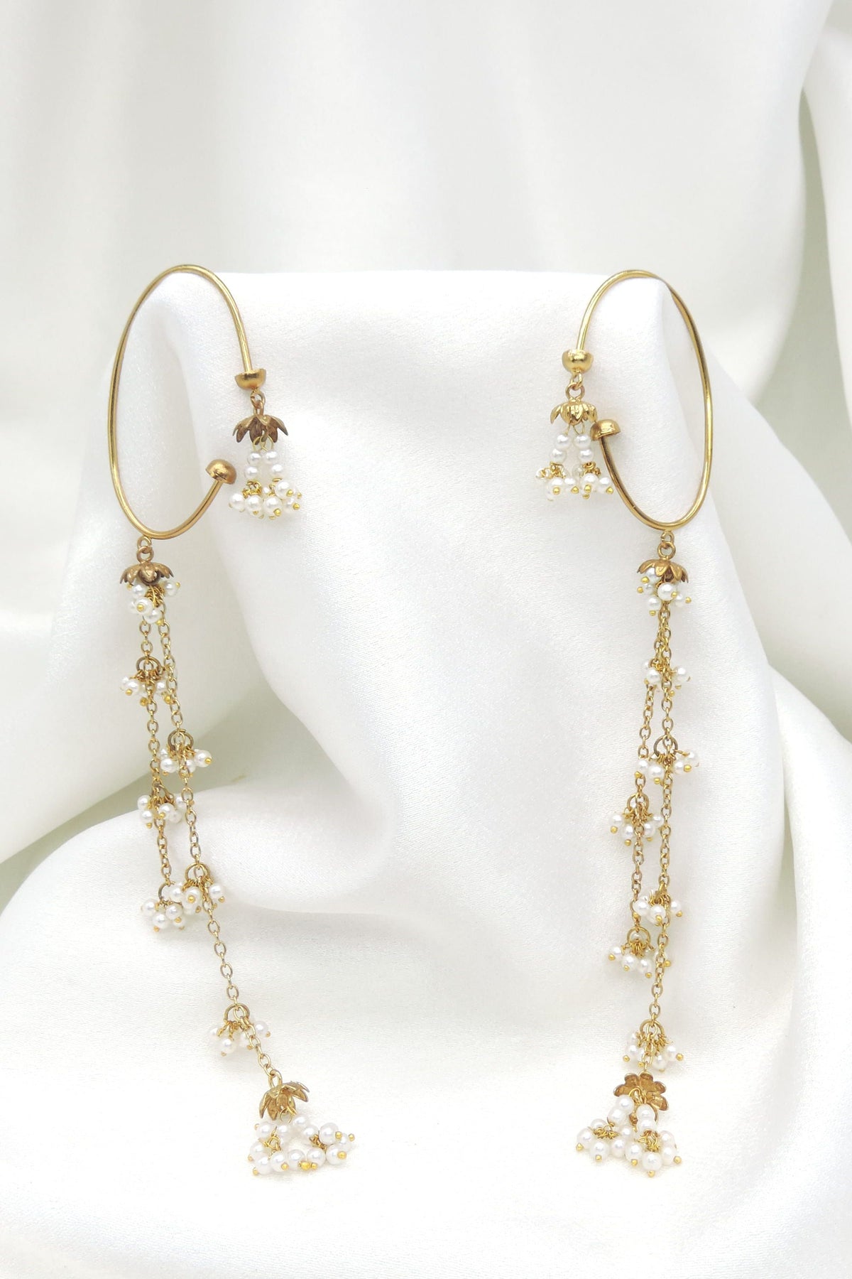 Gold-toned pearl long chain ear cuff earrings with delicate floral detailing by joyrias