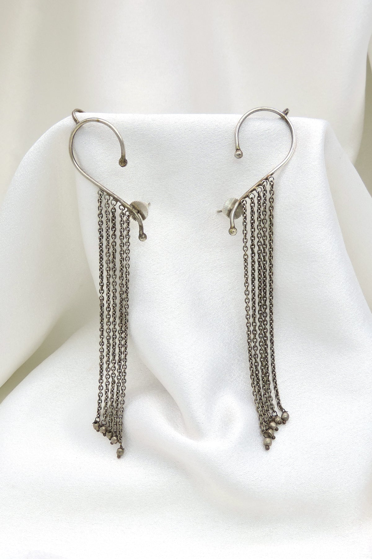 Oxidized silver long chain ear cuff earrings with delicate tassel detailing by joyrias