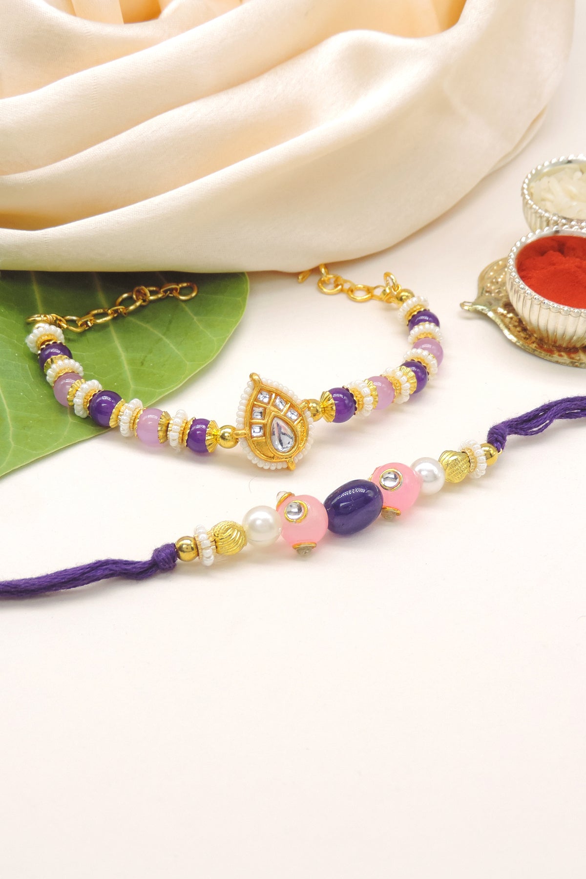 Purple Pink Kundan Pearl Bhaiya Bhabhi Rakhi Set
