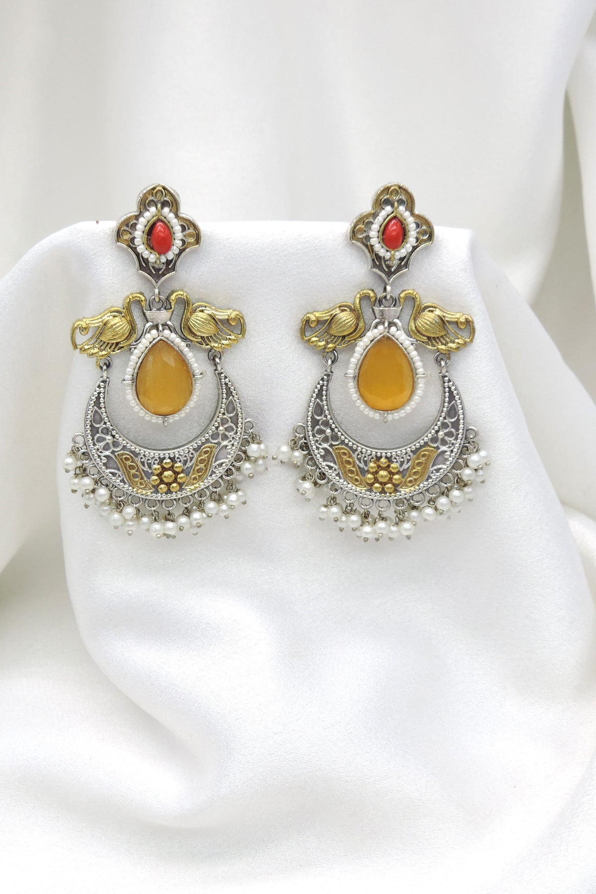 Oxidized dual-tone maroon yellow chandbali pearl earrings with intricate traditional detailing by joyrias