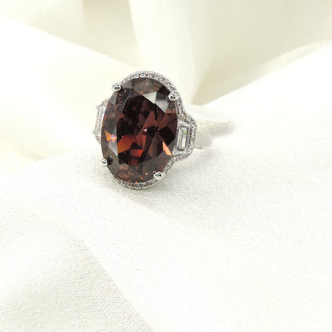 Dark brown oval CZ baguette cocktail ring by Joyrias