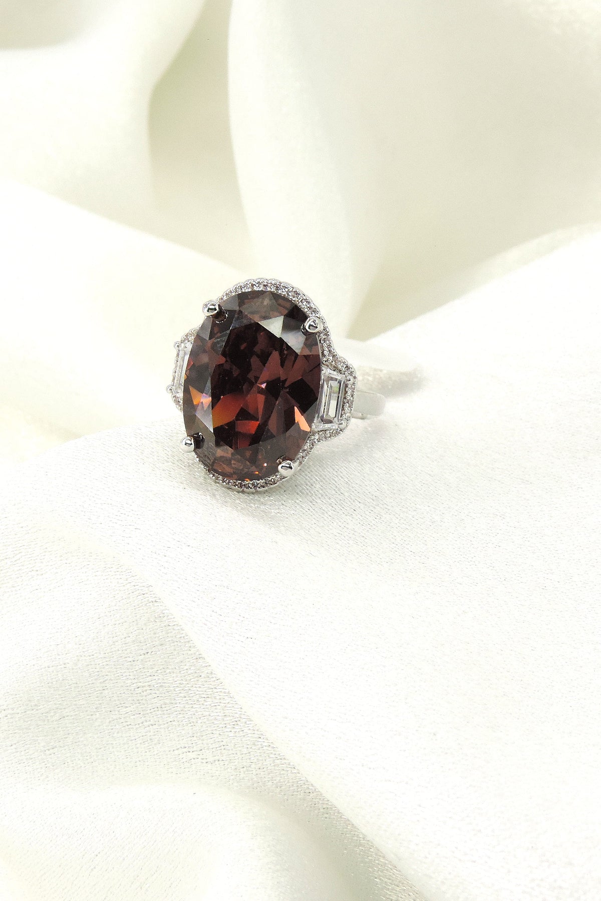 Dark brown oval CZ baguette cocktail ring by Joyrias