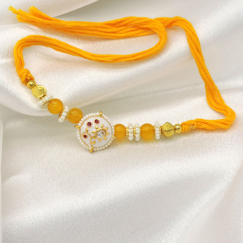 Floral Designer Rakhi with Yellow Beads