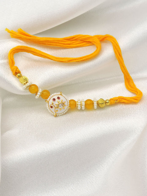 Floral Designer Rakhi with Yellow Beads