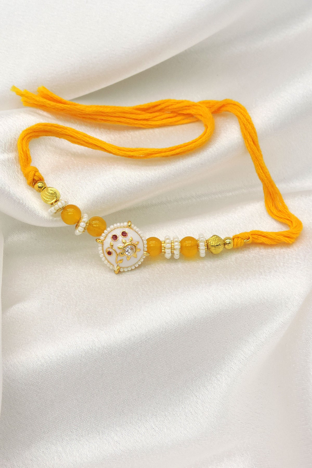 Floral Designer Rakhi with Yellow Beads
