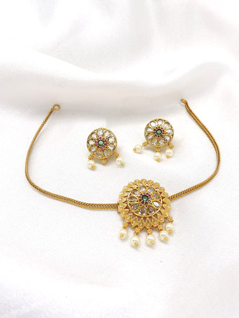 Temple gold-toned kundan pearl floral necklace set with matching earrings by joyrias