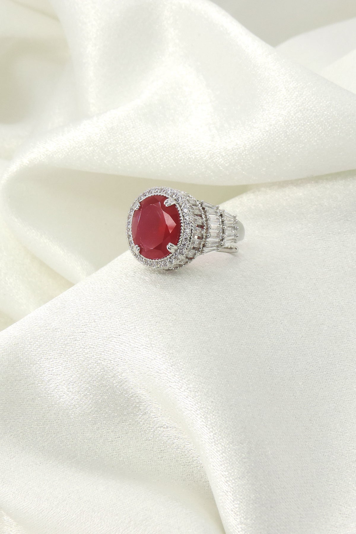 Ruby red oval CZ baguette shoulder cocktail ring by Joyrias