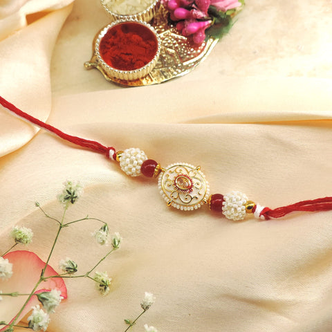 Pearl Designer Rakhi with Red Beads