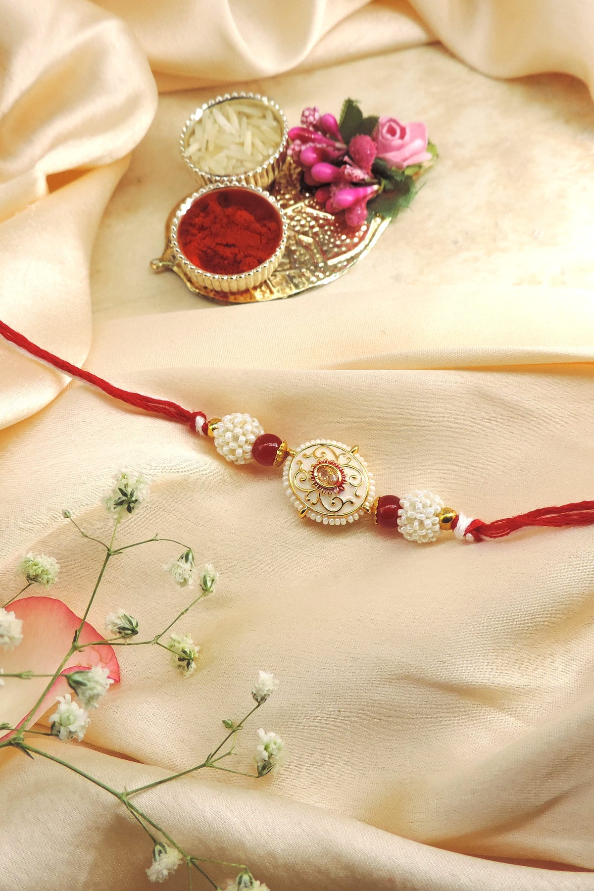 Pearl Designer Rakhi with Red Beads