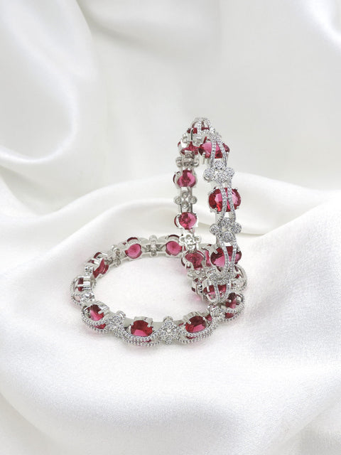 Silver-toned pink stone AD bangle set with intricate floral detailing by joyrias