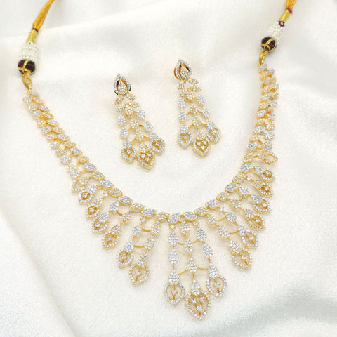 Gold plated layered teardrop necklace set with sparkling stones and matching earrings