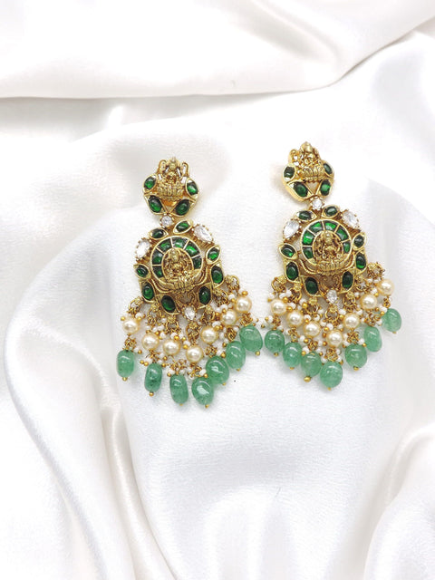 Temple gold-toned Lakshmi necklace set with green stones and pearl drops by joyrias