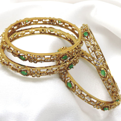 Emerald floral CZ AD bangle set with gold-tone detailing by joyrias