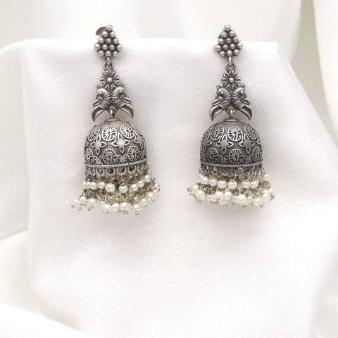 Oxidized silver floral jhumka earrings with intricate dome detailing and pearl fringe by joyrias