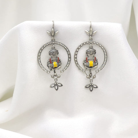 Oxidized silver tribal drummer drop earrings with red and yellow detailing by joyrias