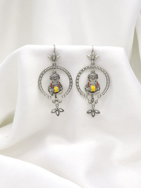 Oxidized silver tribal drummer drop earrings with red and yellow detailing by joyrias