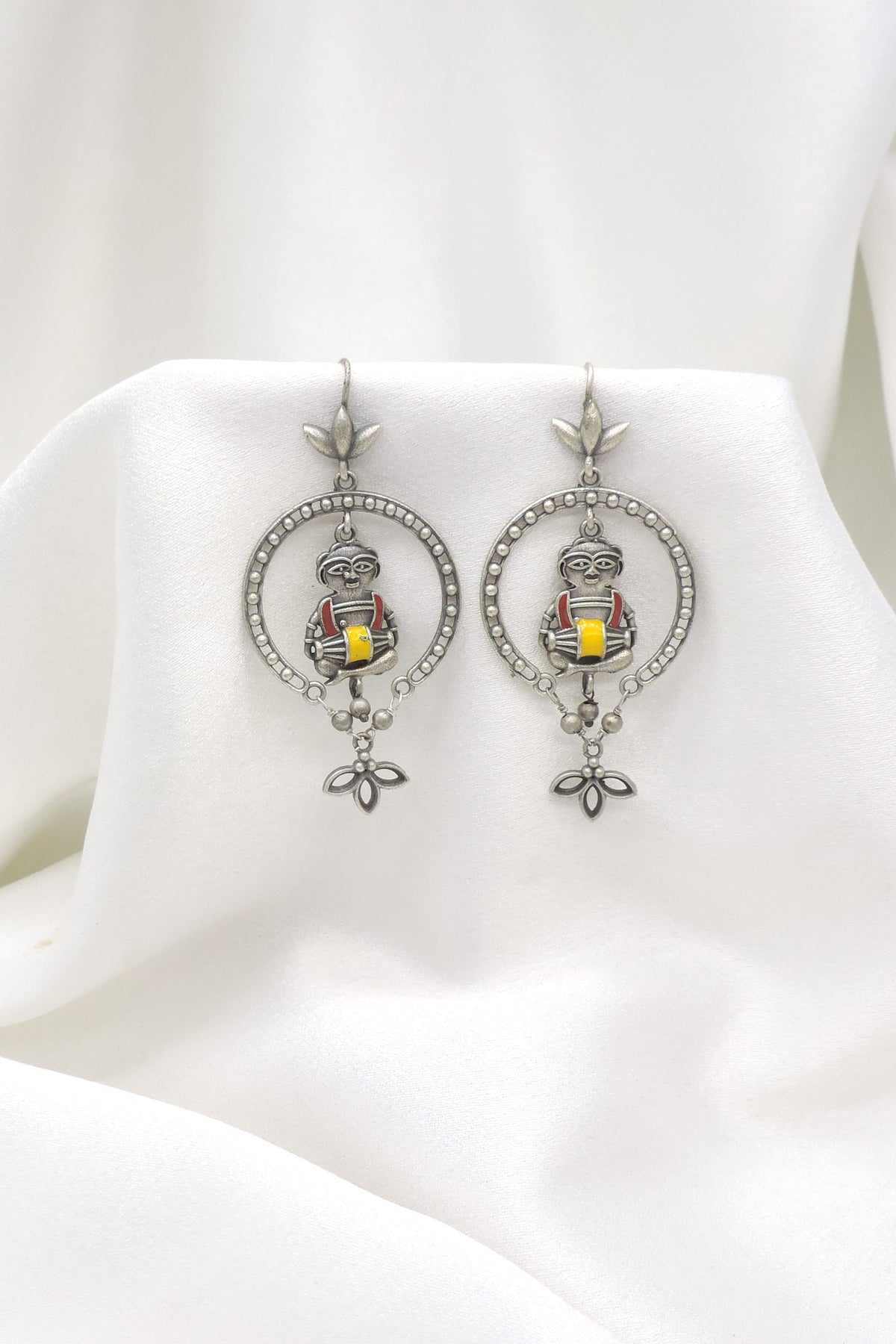 Oxidized silver tribal drummer drop earrings with red and yellow detailing by joyrias