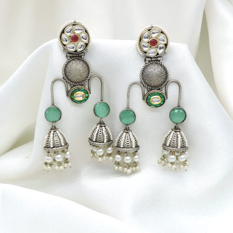 Oxidized silver green kundan jhumka drop earrings with pearl detailing by joyrias